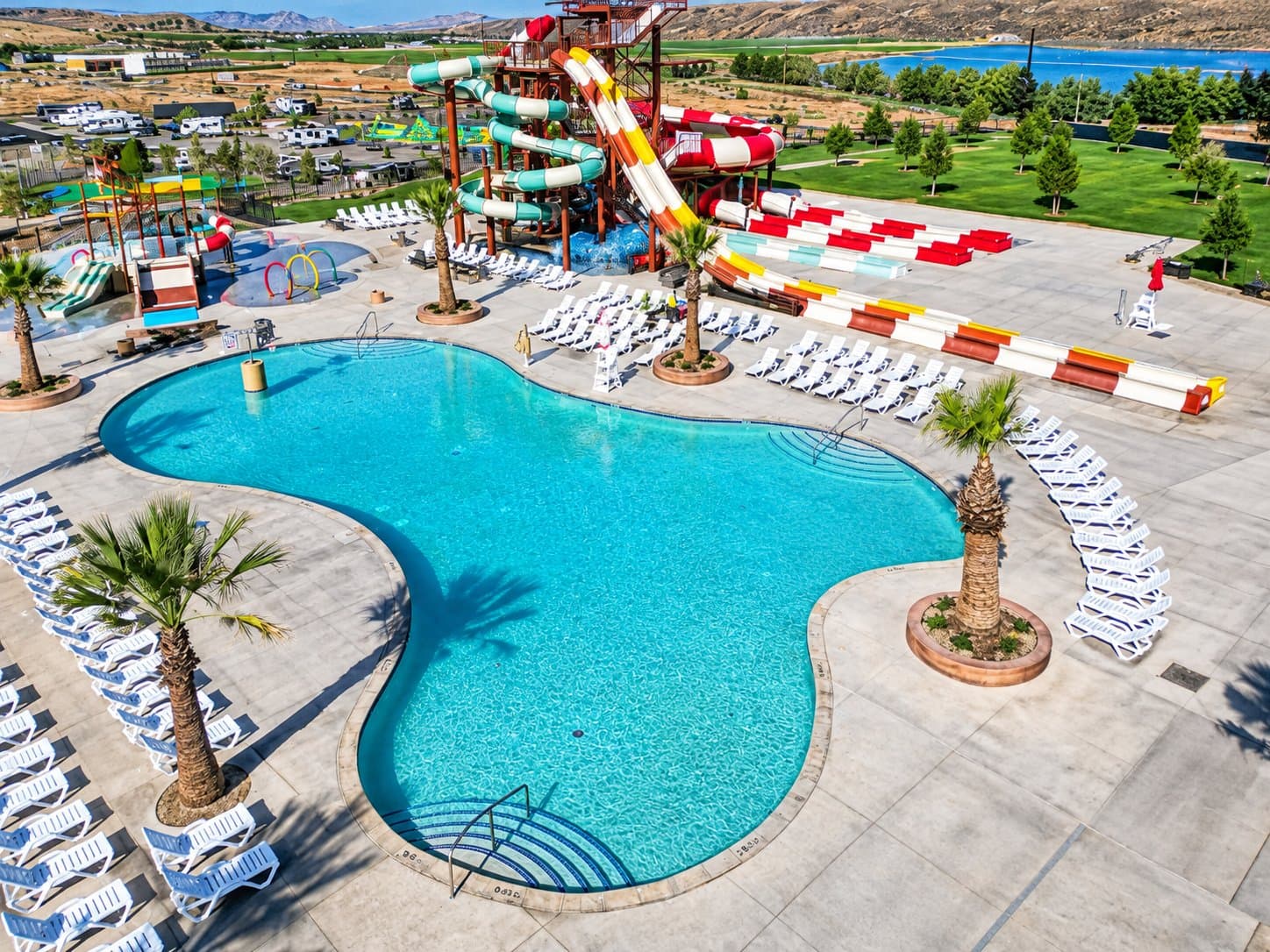 The activity pool, palms and slide tower from above