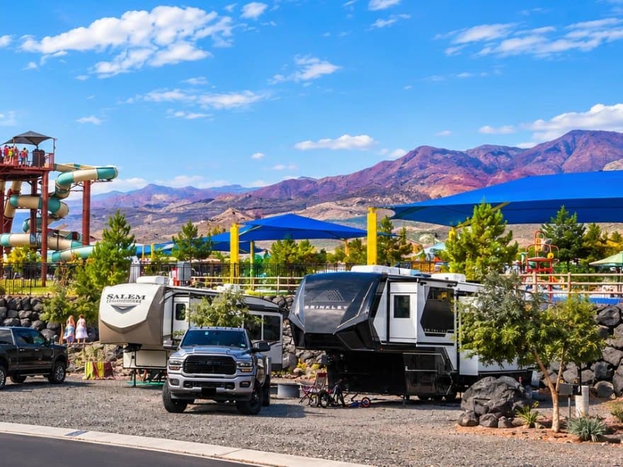 Fifth wheels on landscaped full-hookup sites with the slide tower behind