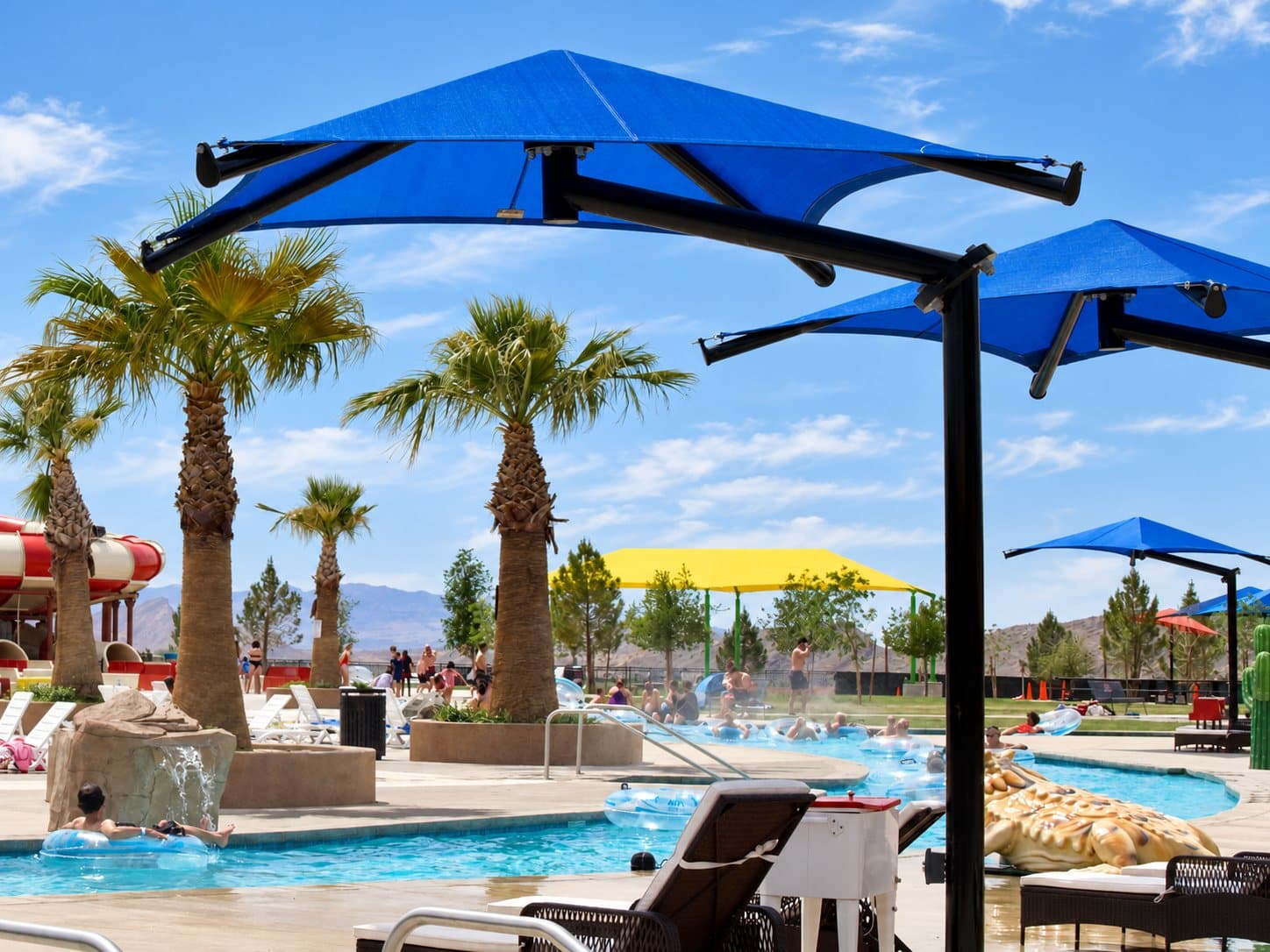 Shade canopies and palms along the lazy river