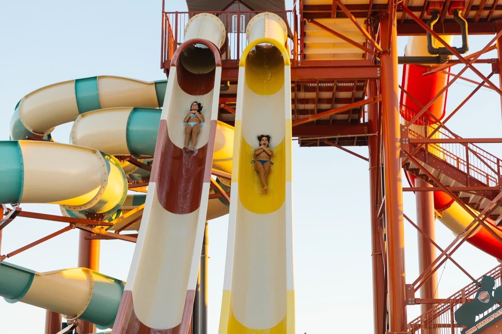 Riders racing down side-by-side water slides at Jellystone Park Zion